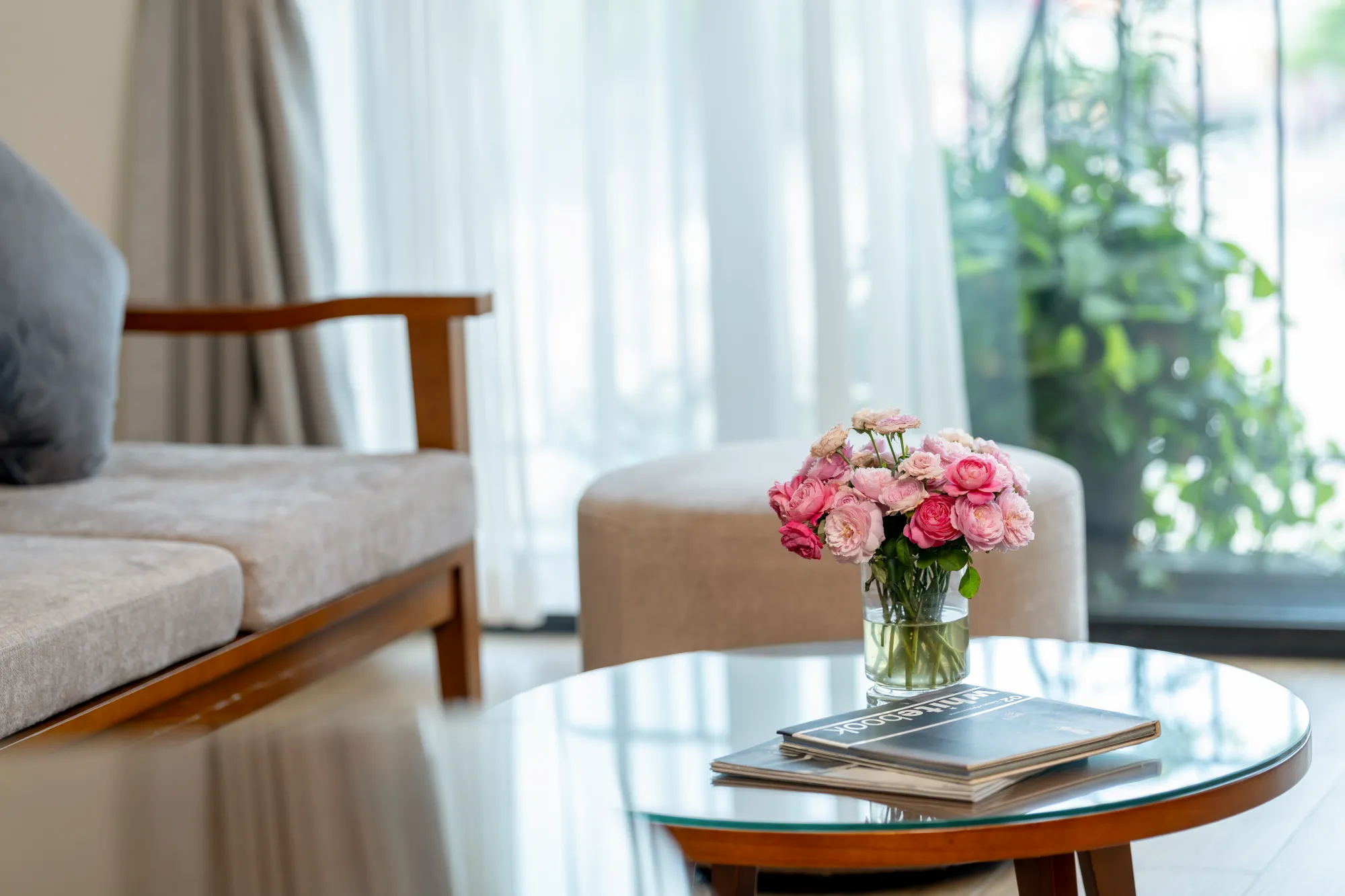 Living area with fresh flowers and garden views
