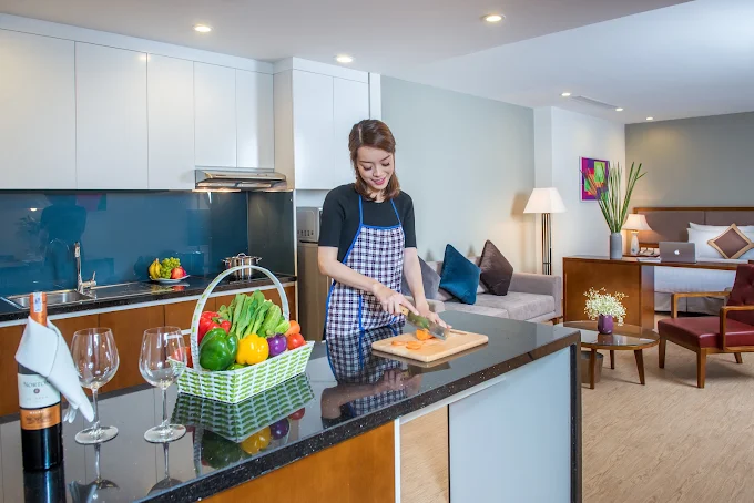 Cooking in a fully equipped apartment kitchen