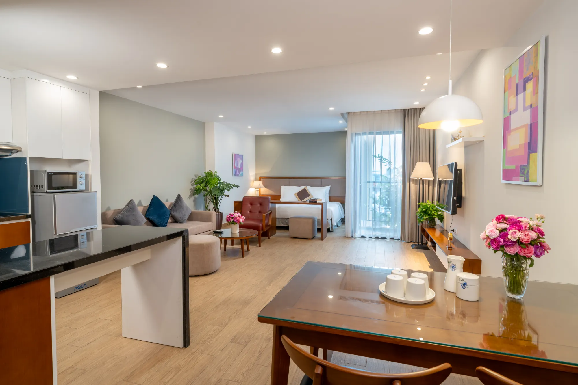 Open-plan executive studio with kitchen, living and sleeping areas